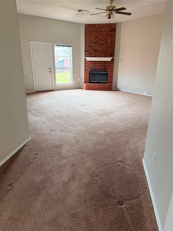 437 Kimmel Drive, Cedar Hill, TX 75104 Vaulted ceiling with a ceiling fan, brick fireplace, and a large window