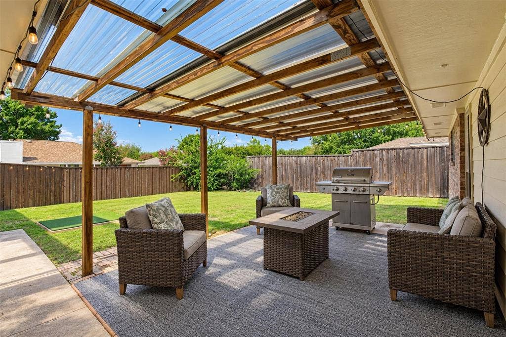 1920 Big Sky Drive, Lewisville, TX 75077 Your own covered outdoor retreat! A pergola-style patio offers a lovely spot to relax or entertain.
