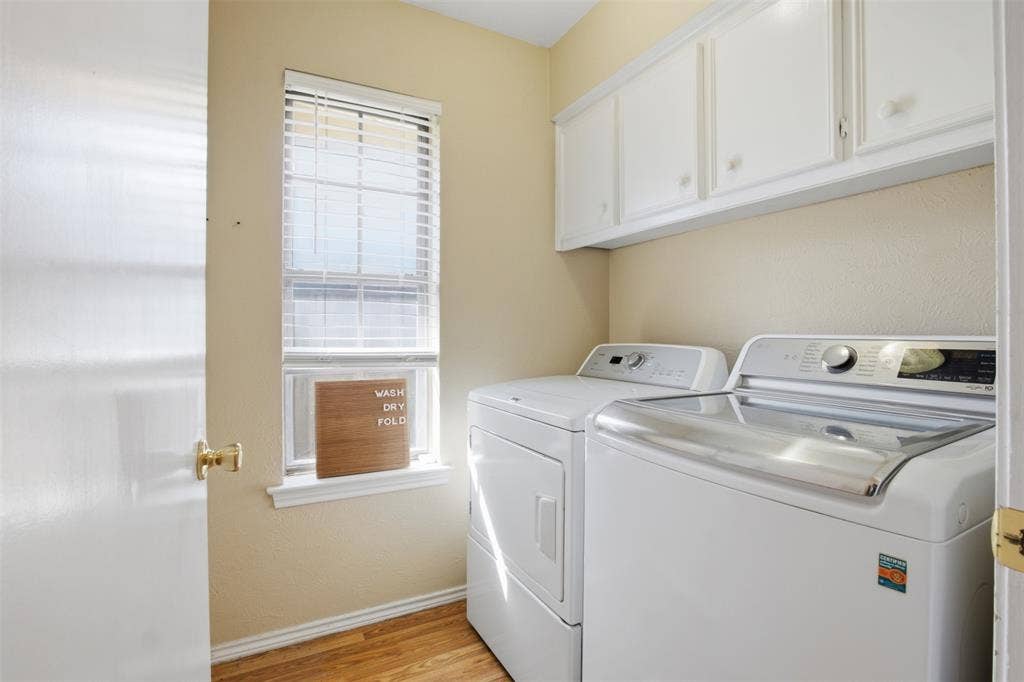 1920 Big Sky Drive, Lewisville, TX 75077 A dedicated laundry room with overhead cabinetry to help keep everyday essentials organized.