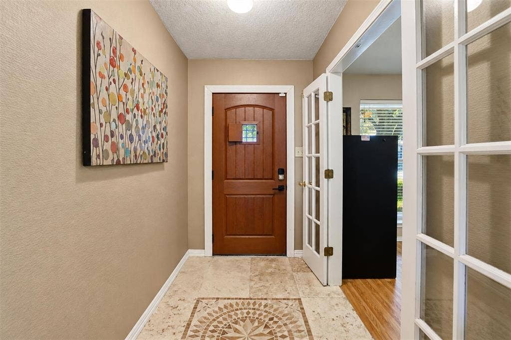 1920 Big Sky Drive, Lewisville, TX 75077 Another look at the inviting entry, with French doors opening to the versatile front room.