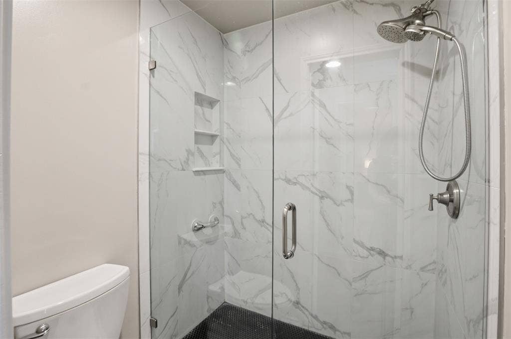 1920 Big Sky Drive, Lewisville, TX 75077 A closer look at the primary bath's shower and updated finishes.