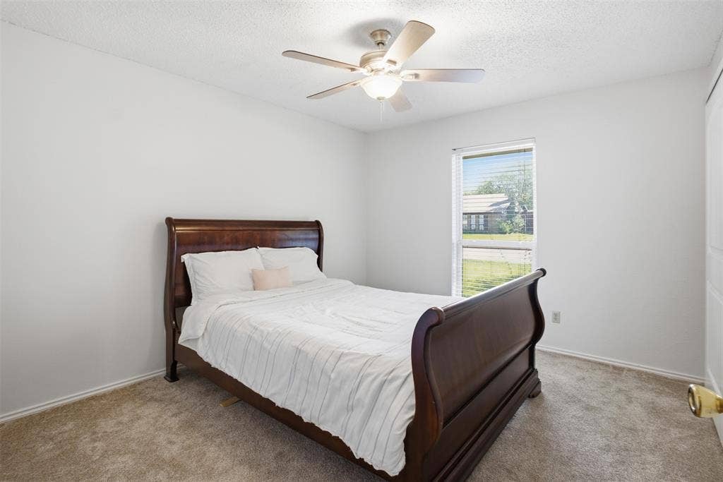 1920 Big Sky Drive, Lewisville, TX 75077 A second inviting bedroom with natural light and a walk-in closet of its own.