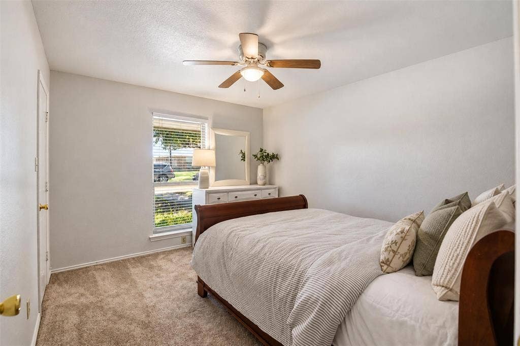 1920 Big Sky Drive, Lewisville, TX 75077 A comfortable secondary bedroom complete with its own walk-in closet.