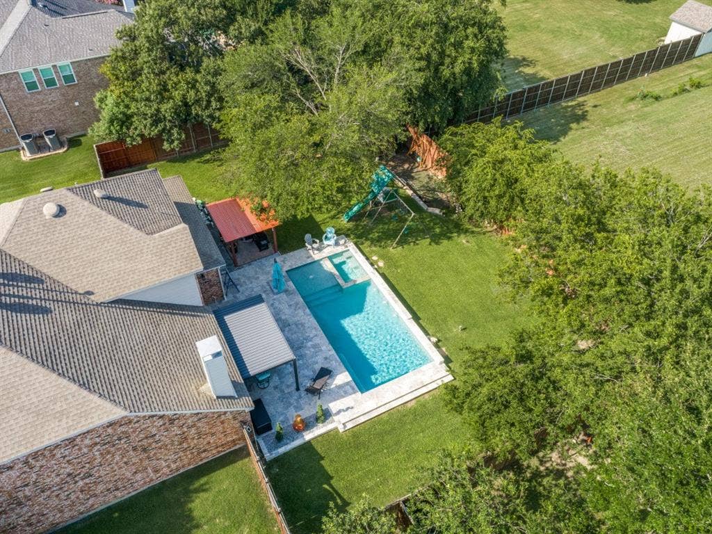 Set on an oversized lot, the backyard retreat offers a sparkling pool, spa, and generous outdoor space perfect for entertaining or relaxing.