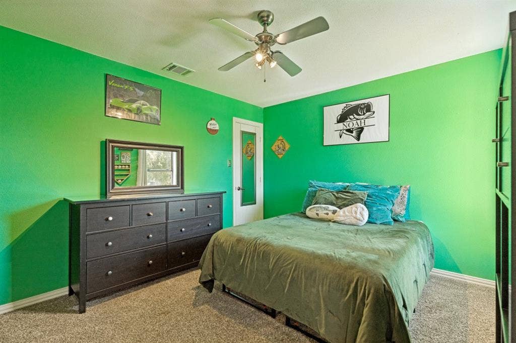 Spacious upstairs bedroom with versatility for family, guests, or a hobby room.