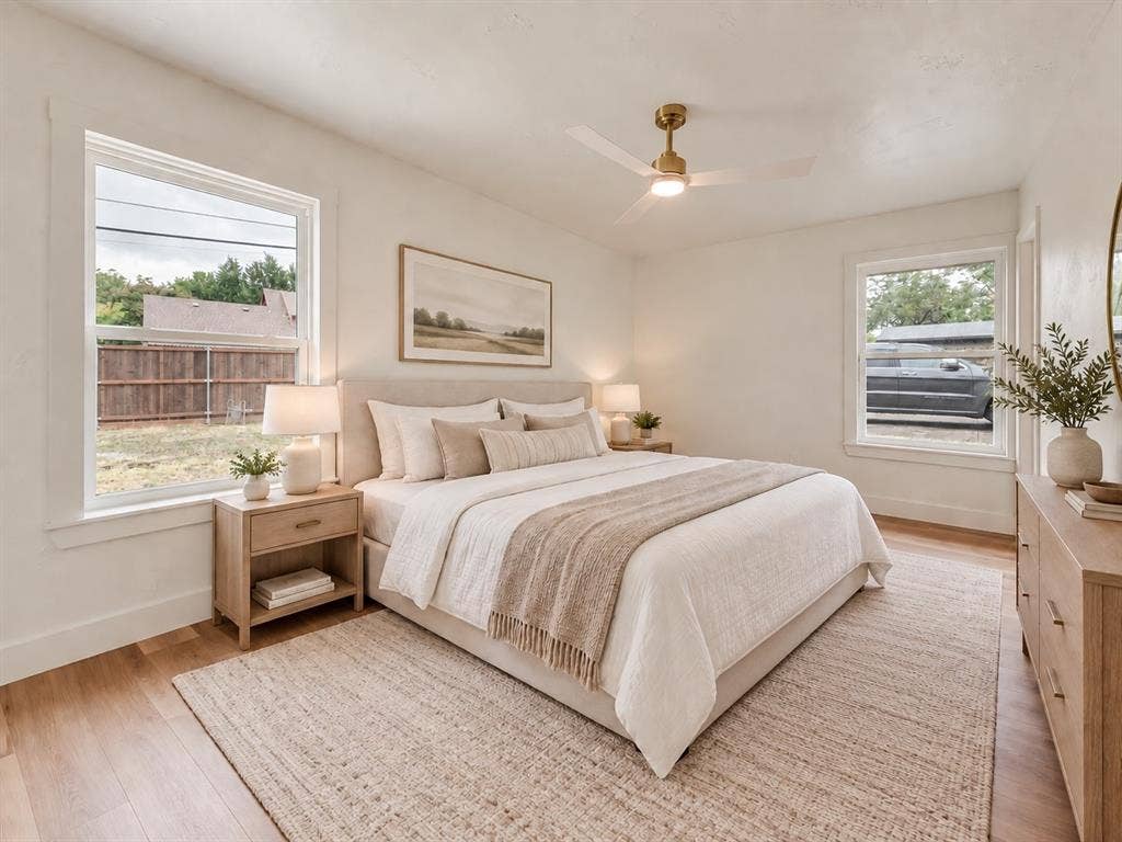 Virtually staged primary bedroom highlights the generous room size.