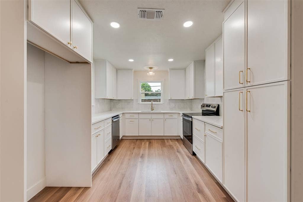 Kitchen features a built-in pantry space.