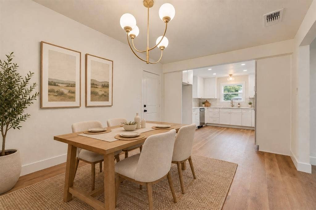 Virtually staged dining area showcases an inviting place to gather.