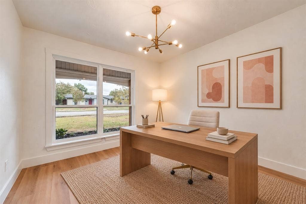 Virtually staged office demonstrates a comfortable work-from-home setup.