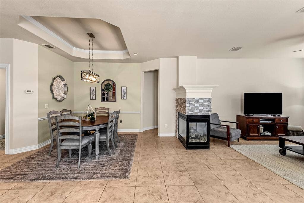153 Byron Nelson Court, Frisco, TX 75036 Dining and Living share a fireplace