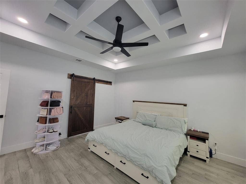 3207 NW 30th Street, Fort Worth, TX 76106 Coffered ceiling with recessed lighting and a ceiling fan, wood-finish flooring, and a barn door