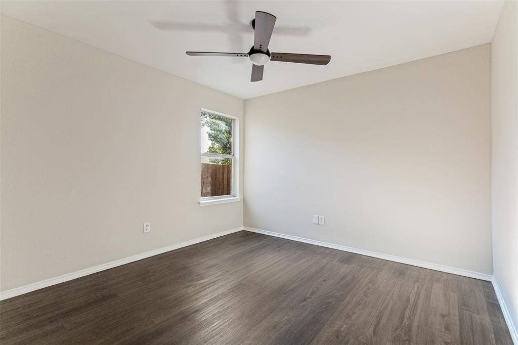 4545 Grainland Court, Fort Worth, TX 76179 Wood-finish flooring, neutral wall paint, and a ceiling fan with light fixture