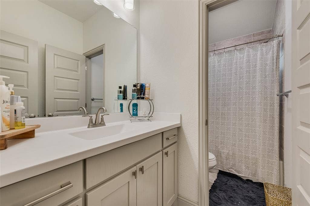 107 White Sands Lane, Forney, TX 75126 Secondary full bathroom with vanity storage and a tub/shower combination