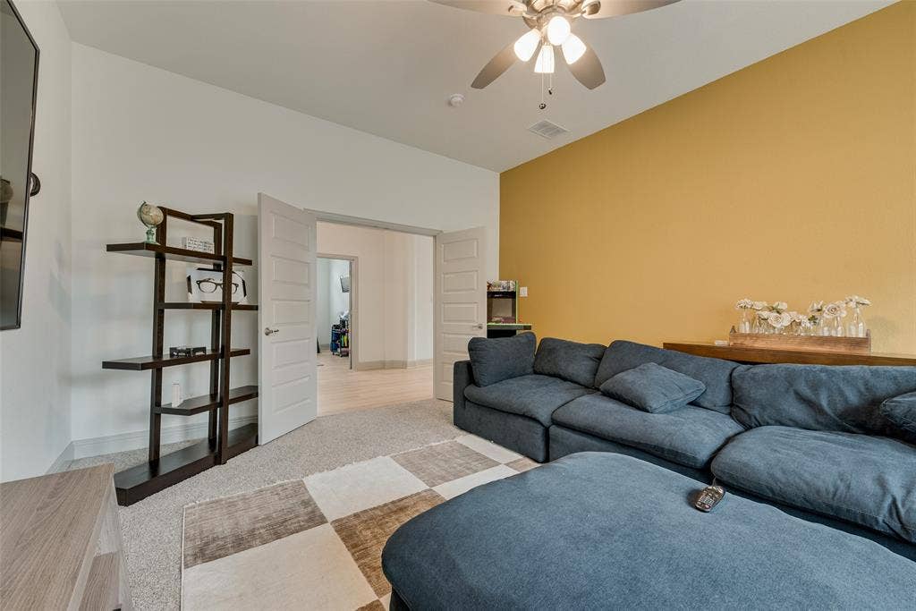 107 White Sands Lane, Forney, TX 75126 Game room with a ceiling fan, carpeted flooring, and a warm accent wall