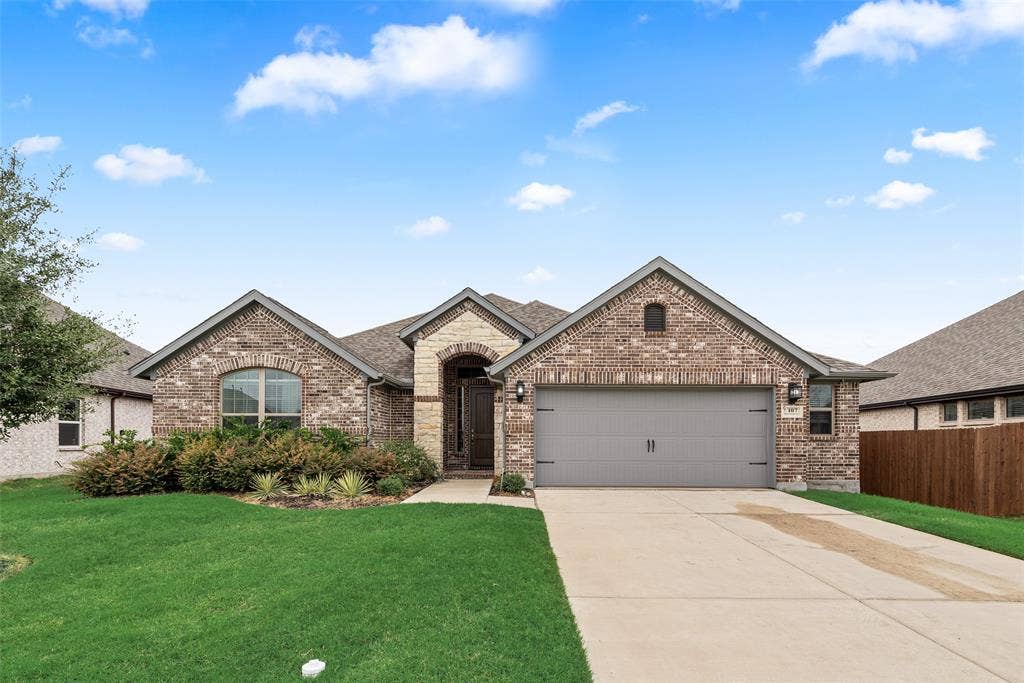 107 White Sands Lane, Forney, TX 75126 Brick exterior with a two-car garage