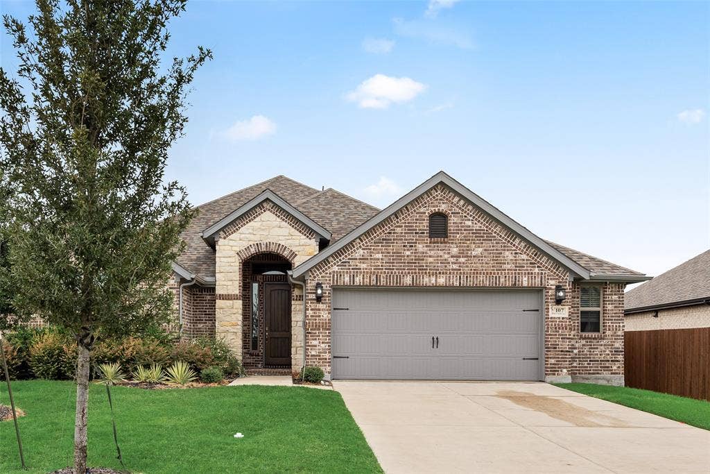 107 White Sands Lane, Forney, TX 75126 Brick exterior with a gabled roof
