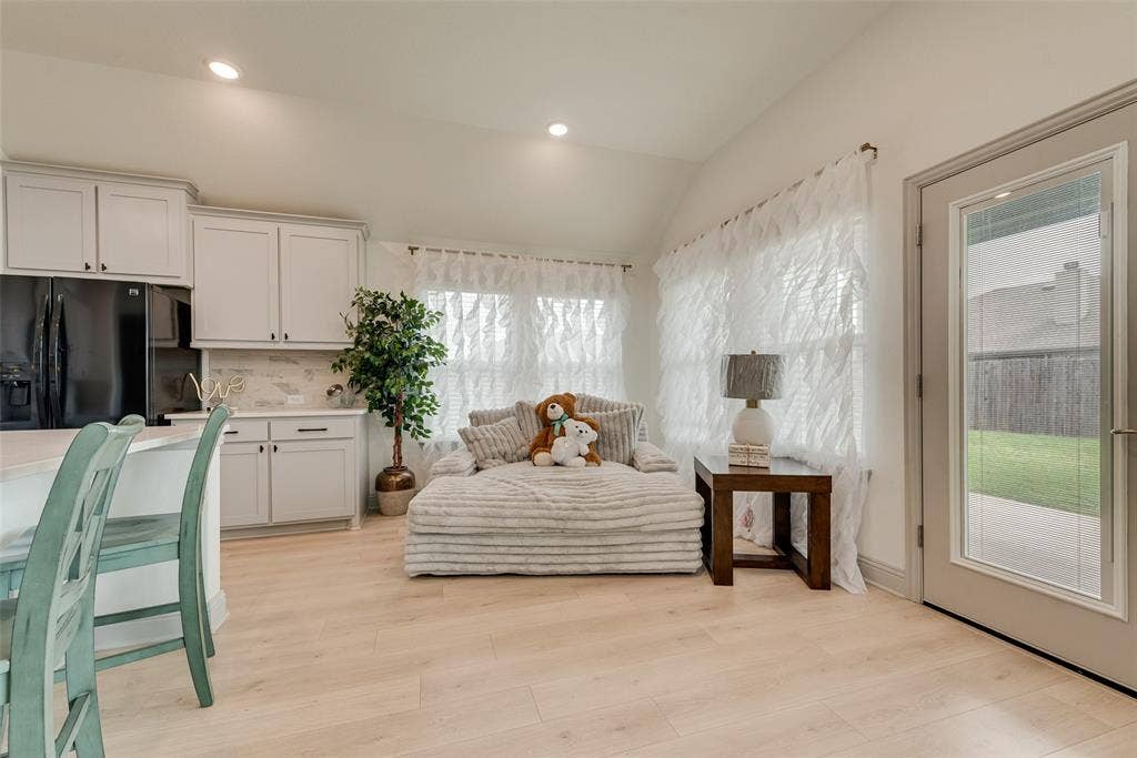 107 White Sands Lane, Forney, TX 75126 Breakfast area beside the kitchen with natural light and access to the covered back patio