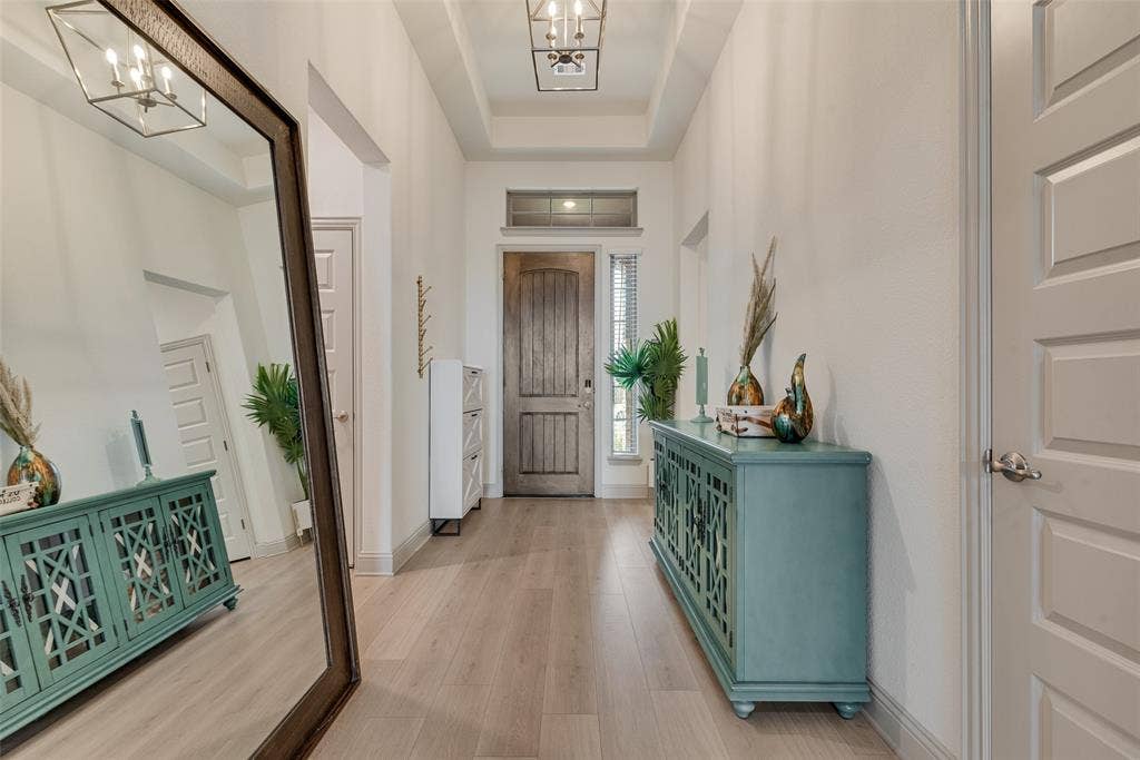 107 White Sands Lane, Forney, TX 75126 Entrance foyer with tray ceilings, recessed lighting, and wood-finish flooring