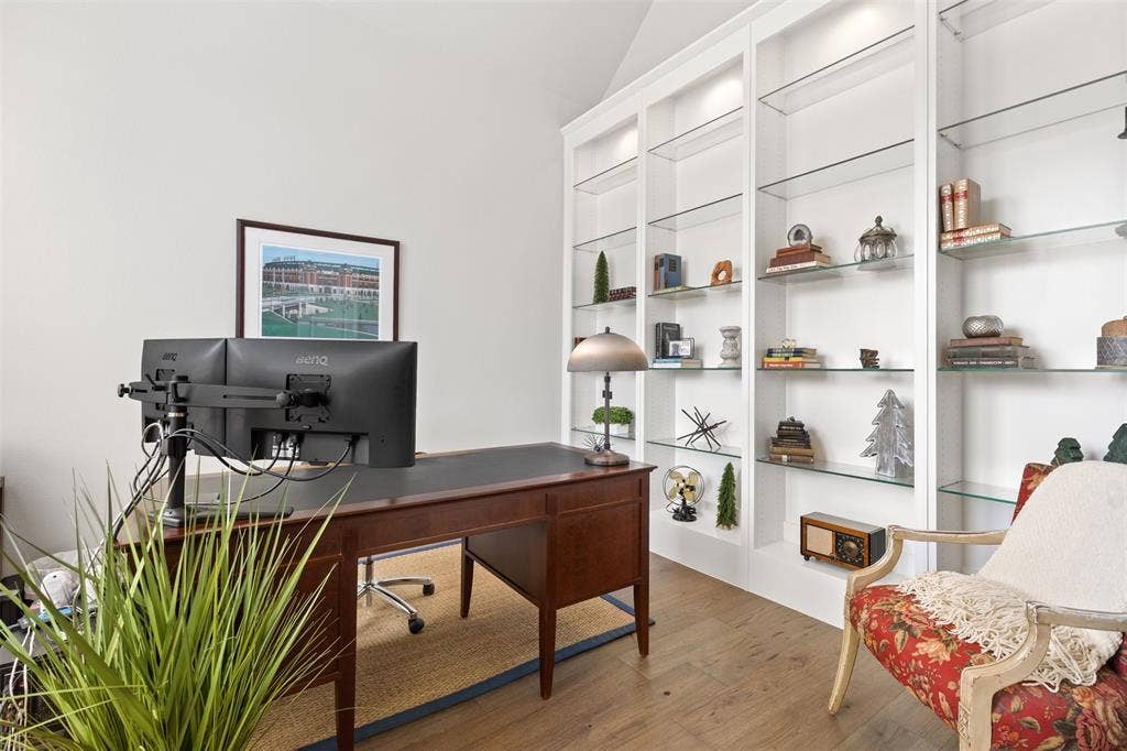 9716 Wilderness Road, Little Elm, TX 75068 Office with Built-in shelving and ntegrated lighting, wood-finish flooring, and vaulted ceiling