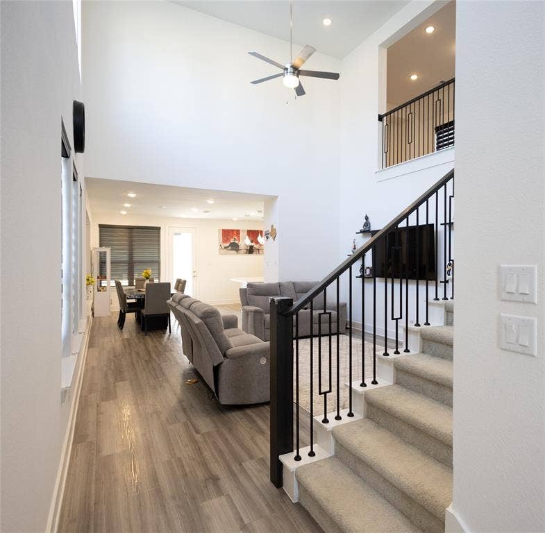 3017 Andorra Road, McKinney, TX 75071 Two-story vaulted ceiling with a ceiling fan, recessed lighting, and wood-finish flooring