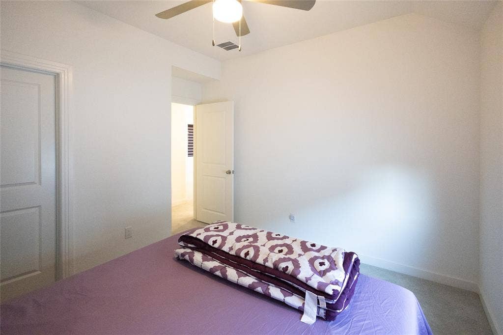 3017 Andorra Road, McKinney, TX 75071 Carpeted flooring, white interior doors, and a ceiling fan with integrated lighting