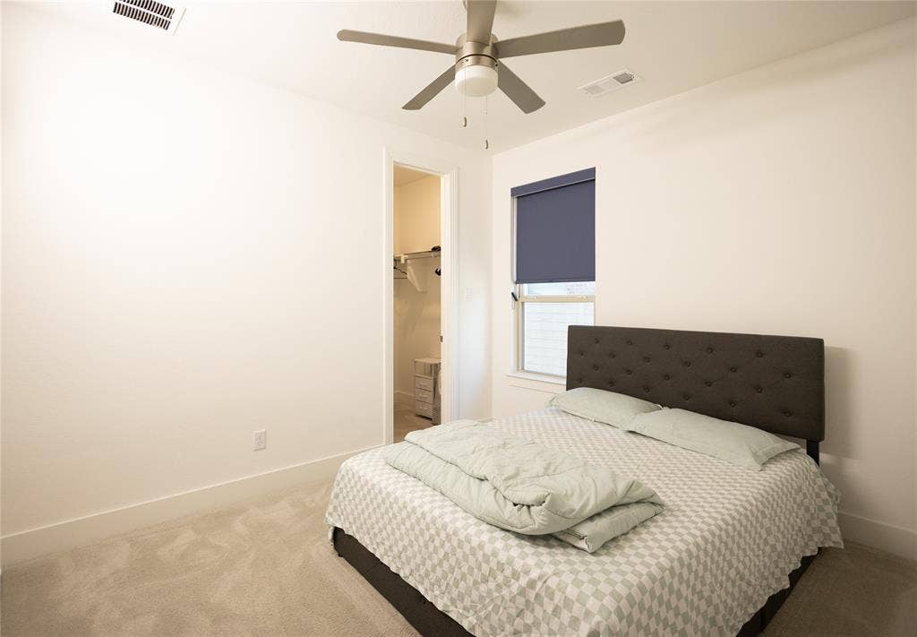 3017 Andorra Road, McKinney, TX 75071 Plush carpet flooring, recessed window with roller shade, ceiling fan with integrated lighting, and a closet with shelving