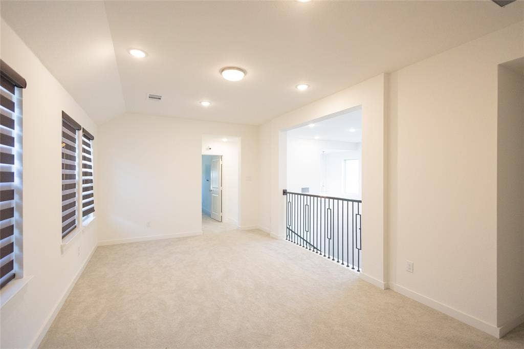 3017 Andorra Road, McKinney, TX 75071 Carpeted room with vaulted ceiling and recessed lighting