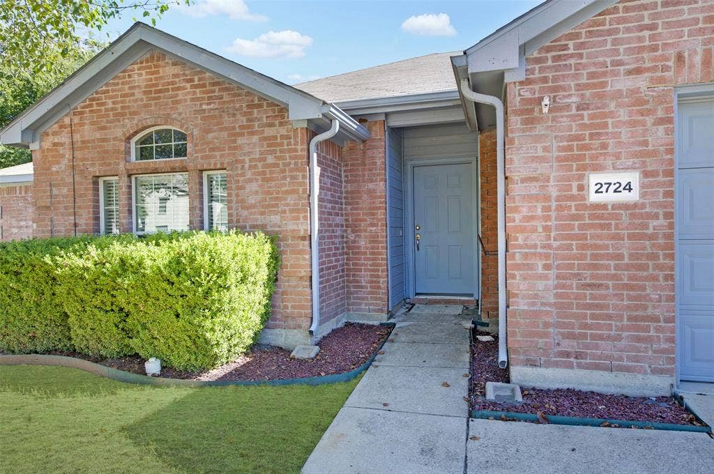 2724 Douglas Drive, McKinney, TX 75071 Brick exterior with attractive gray trim, side walk and front door