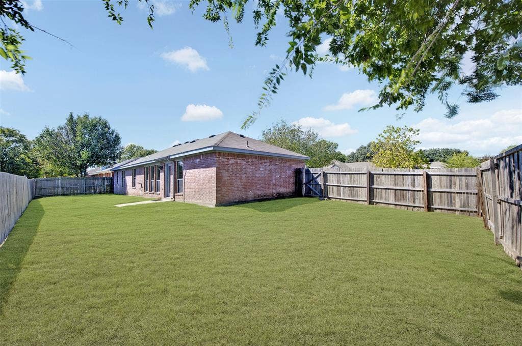 2724 Douglas Drive, McKinney, TX 75071 Expansive backyard, fully fenced and a low maintenance brick exterior with multiple windows
