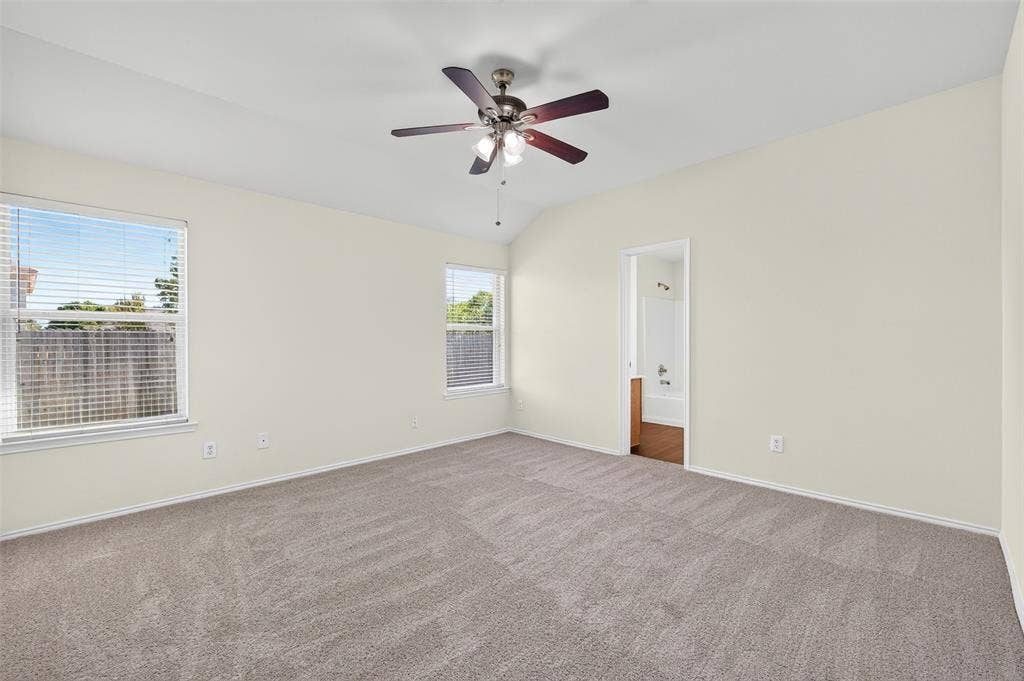 2724 Douglas Drive, McKinney, TX 75071 Two windows, looking to fenced backyard, ceiling fan and new neutral carpeting