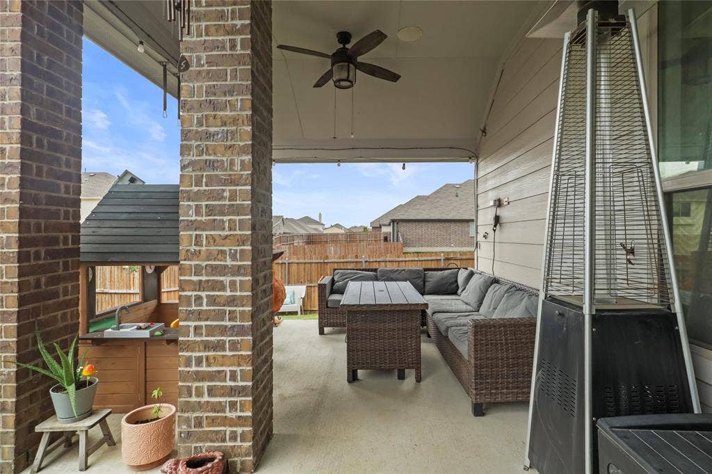 6152 Cobbetts Pond Lane, Fort Worth, TX 76179 Covered patio with brick columns, recessed lighting, and a ceiling fan
