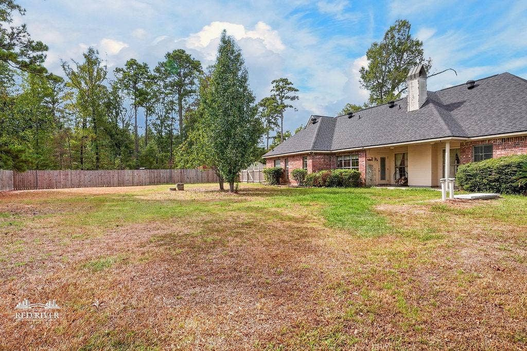 10571 Norris Ferry Road, Shreveport, LA 71106 Back view of house & shows storm shelter.