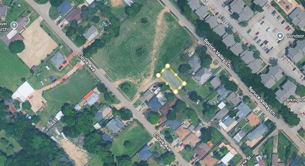 Aerial Map. An overhead satellite image displaying the property outlined in yellow, positioned between Clovis Ave and Spruce Valley Ln