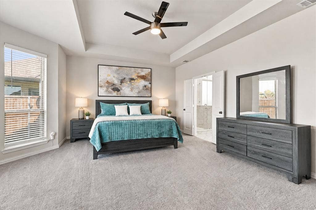 Tray ceiling with recessed lighting and a ceiling fan
