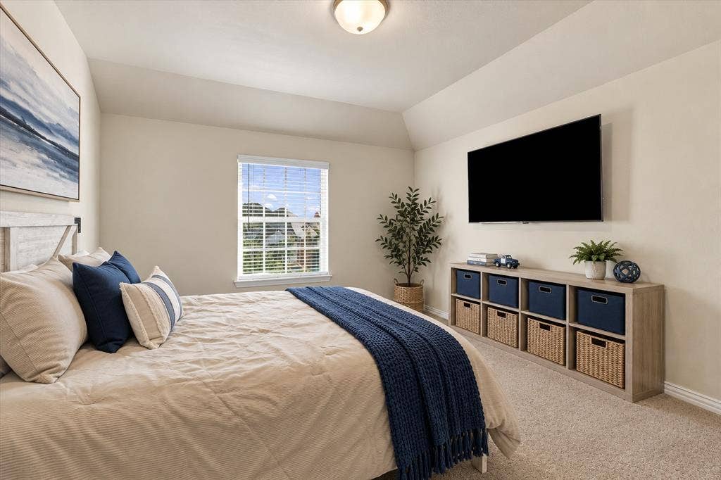Angled ceiling featuring a built-in light fixture, a window with horizontal blinds, and wall-to-wall carpeting