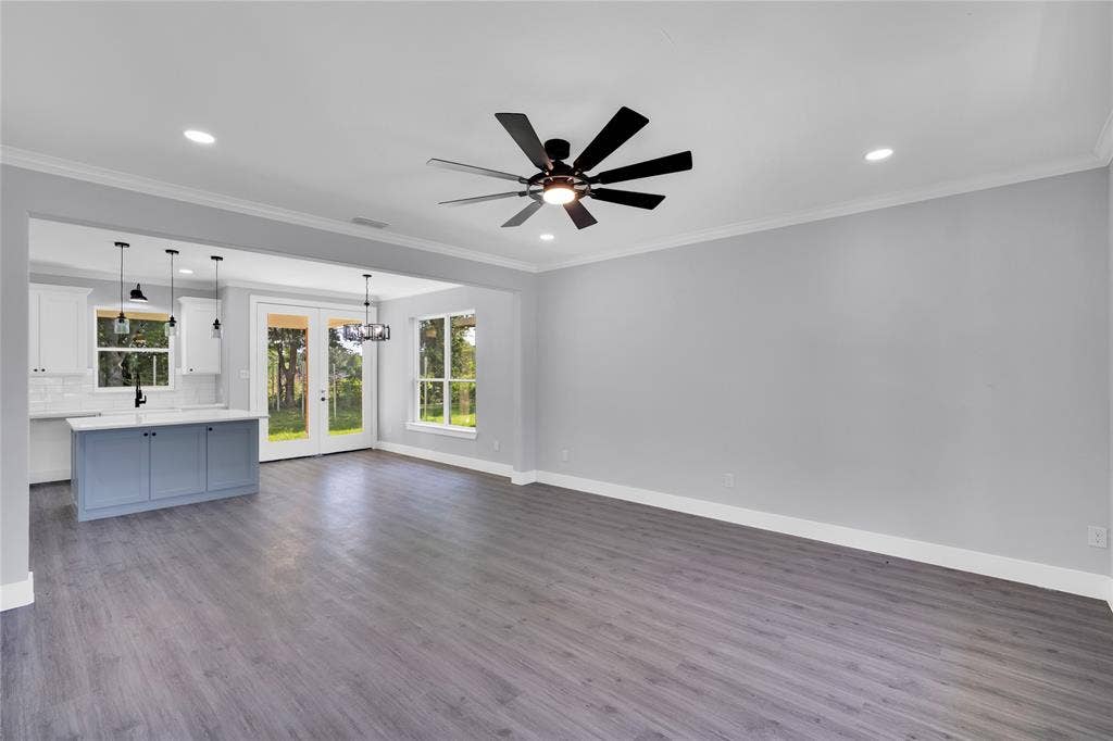 1995 Lakeview Drive, Kemp, TX 75143 Spacious interior featuring wood-finish flooring, recessed lighting, and a contemporary ceiling fan