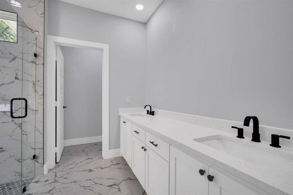 1995 Lakeview Drive, Kemp, TX 75143 Dual vanity with solid surface countertop, undermount sinks, and matte black fixtures