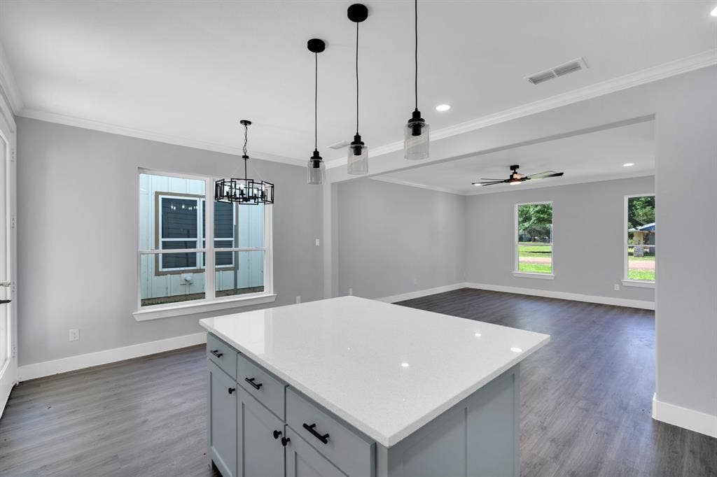 1995 Lakeview Drive, Kemp, TX 75143 Kitchen island with a white countertop and light blue cabinetry, featuring pendant lighting and recessed illumination