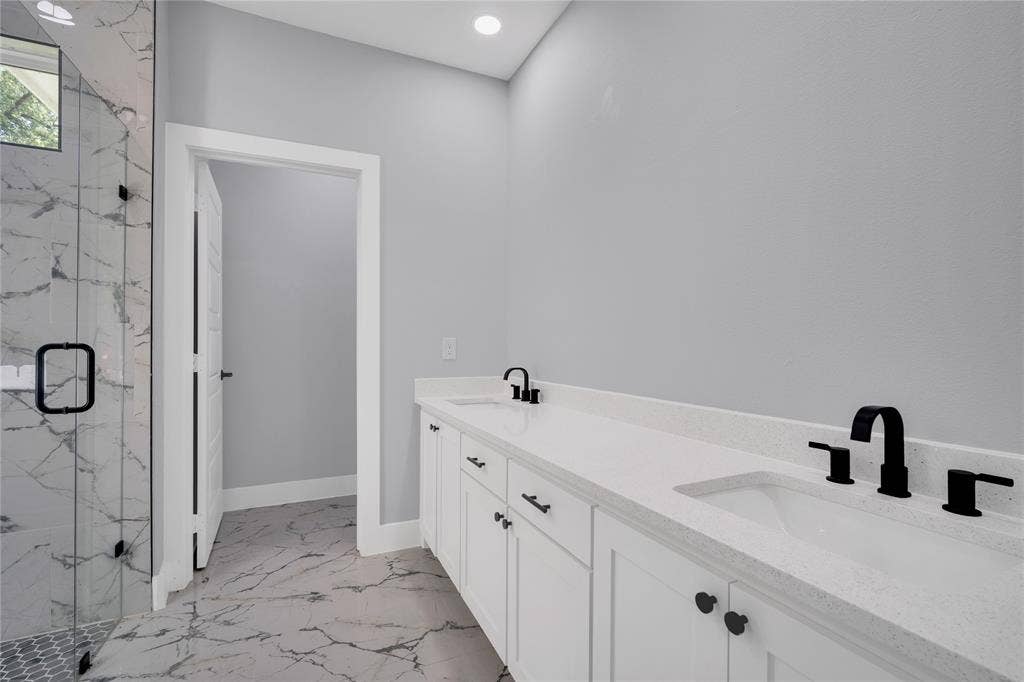 1995 Lakeview Drive, Kemp, TX 75143 Dual vanity with white cabinetry and integrated sinks