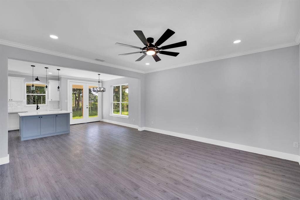 1995 Lakeview Drive, Kemp, TX 75143 Recessed lighting, crown molding, a ceiling fan, wood-finish flooring, and double doors