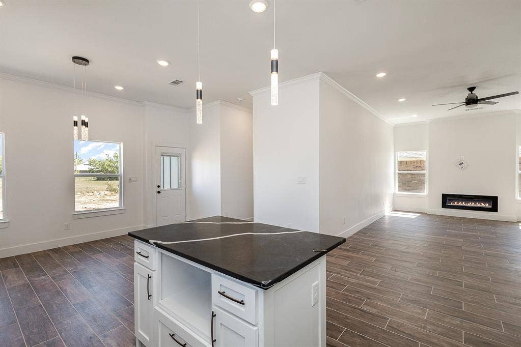 230 Flying Bridge Drive, Gun Barrel City, TX 75156 Dining to the left and full view of living room with fireplace