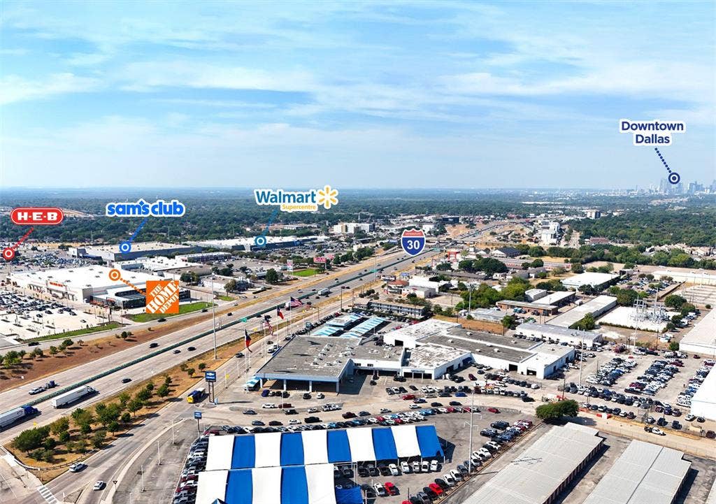3650 N Buckner Boulevard, Dallas, TX 75228 Aerial perspective with Interstate 30, visible retail centers including H-E-B, Sam's Club, Walmart, and The Home Depot, and the distant Dallas skyline