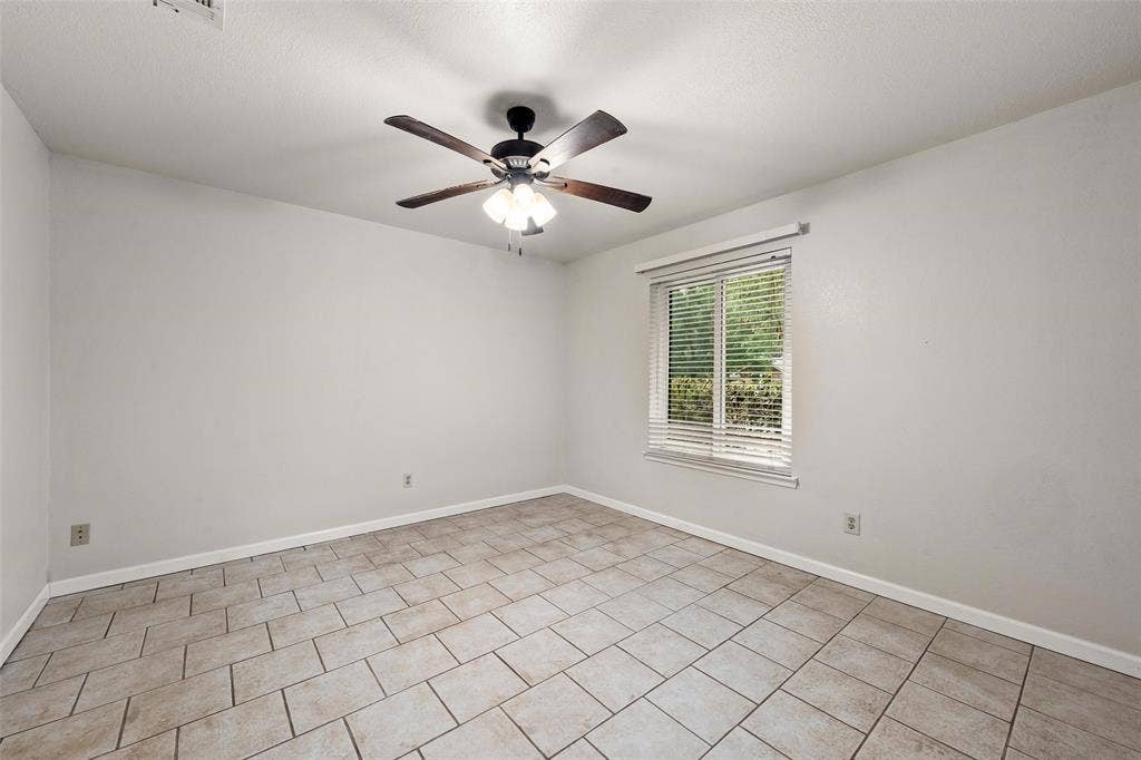 812 Regina Drive, Hewitt, TX 76643 Tiled flooring, ceiling fan with integrated lighting, and a window with blinds