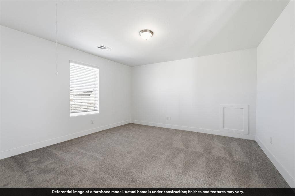 5218 Noland Drive, Princeton, TX 75071 Neutral-toned carpeting, single-pane window with integrated horizontal blinds, flush-mount ceiling light fixture, and inset wall paneling