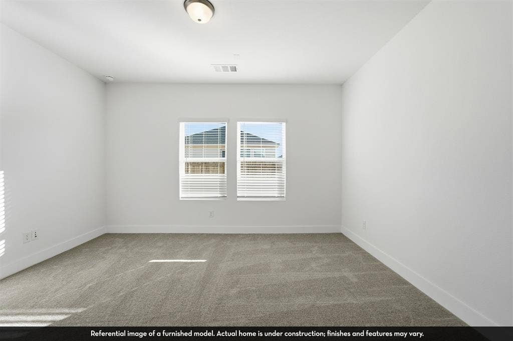 821 Whitmore Drive, Princeton, TX 75071 Neutral-toned wall-to-wall carpeting, dual-pane windows, and a flush-mount ceiling fixture