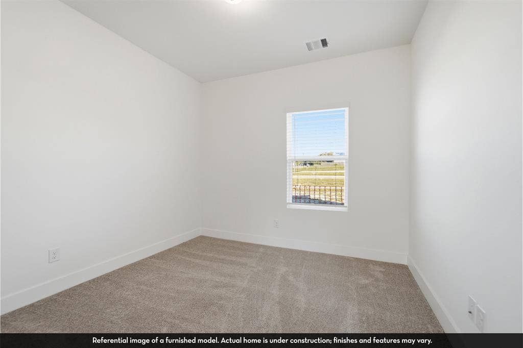 821 Whitmore Drive, Princeton, TX 75071 Neutral-toned wall-to-wall carpeting, crisp white walls, and a single-pane window with installed blinds