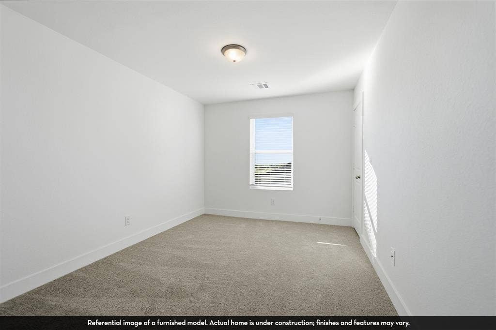 821 Whitmore Drive, Princeton, TX 75071 Interior room featuring neutral wall-to-wall carpeting, crisp white walls, a single window with blinds, and a flush-mount ceiling light fixture