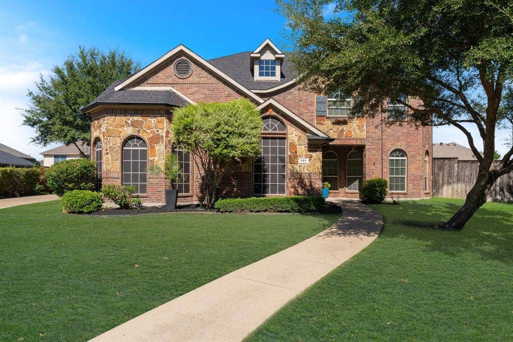 New Roof and a 3 car garage.  Close to shopping and feeds Forney High School.