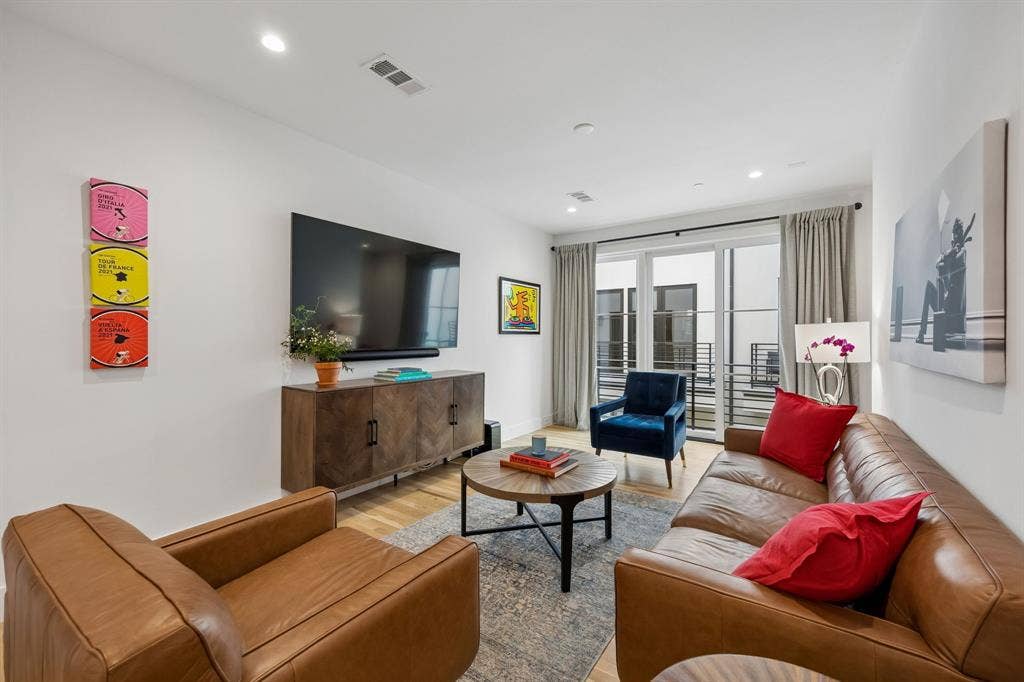 7207 Gaston Avenue, #903, Dallas, TX 75214 Bright and inviting living area with views to outside green space and a personal balcony.