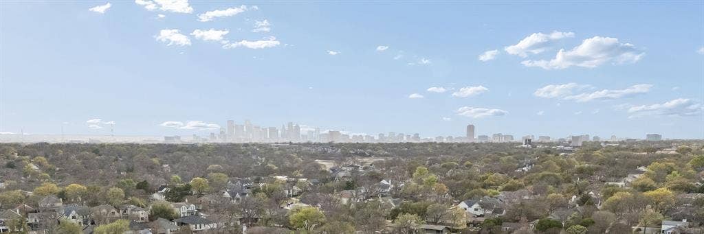 7207 Gaston Avenue, #903, Dallas, TX 75214 View showcasing the natural surroundings with a clear glimpse of the Dallas city skyline.